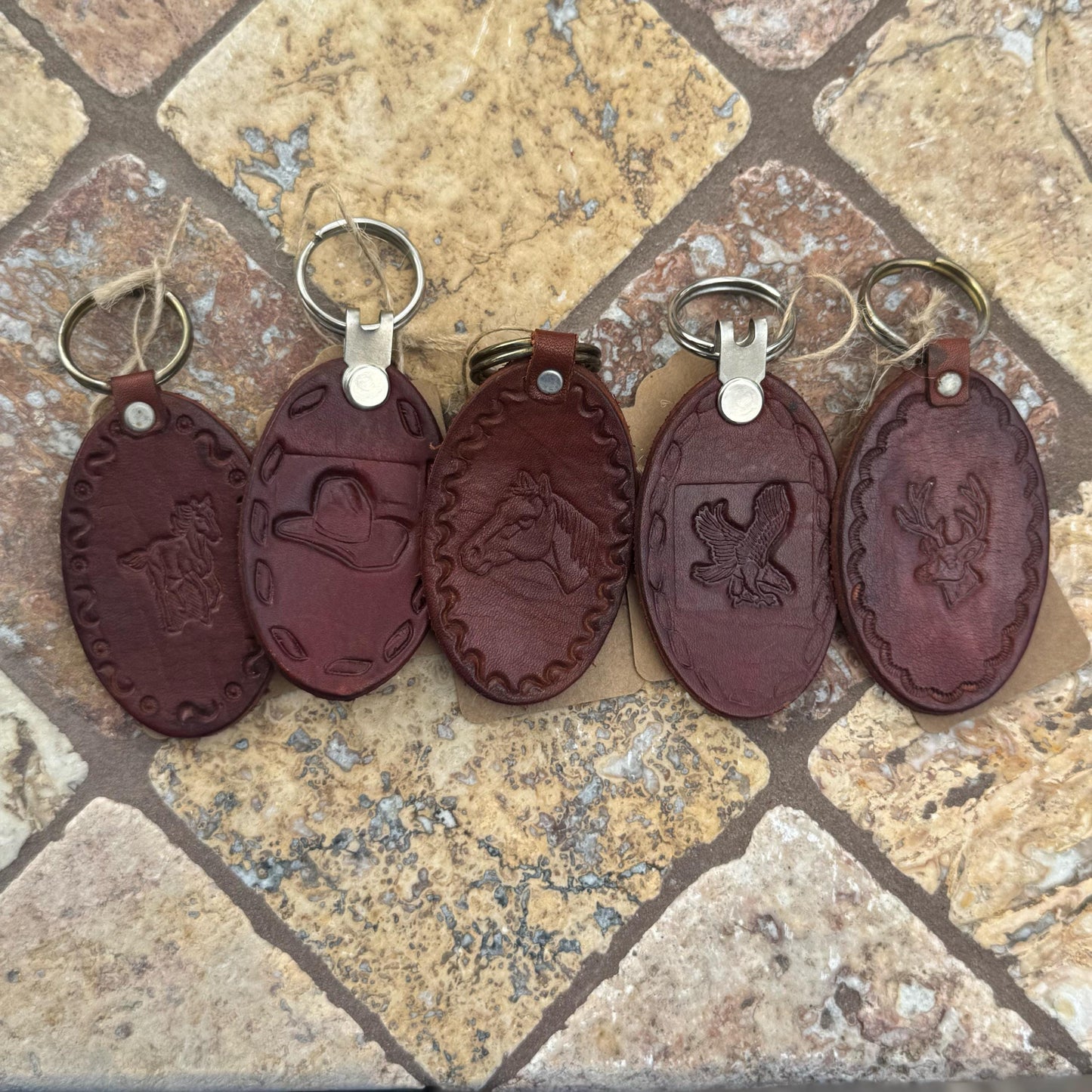 Handcrafted Leather Oval keychain | Horse, Eagle, Deer, Cowboy hat, and Horse head embedded options available | Hand stamped in Mexico